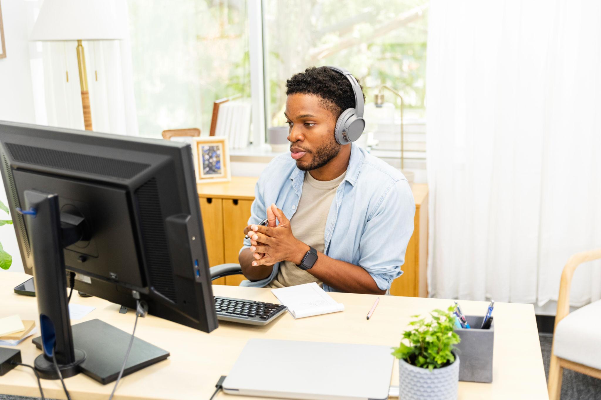Professional IT support technician working on a computer